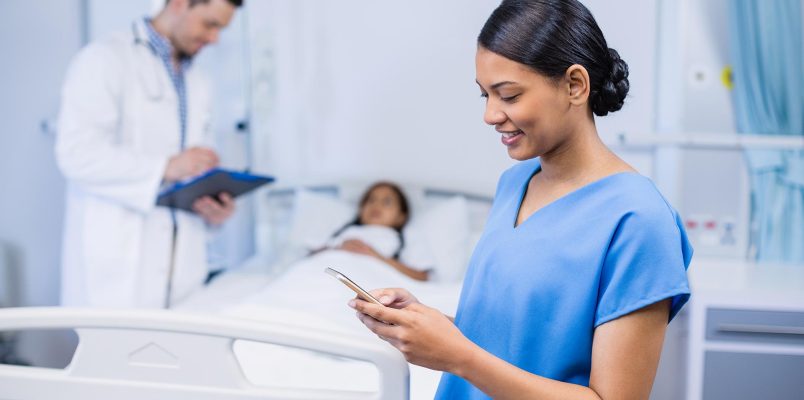 smiling-nurse-using-mobile-phone-2021-08-28-22-14-07-utc.jpg